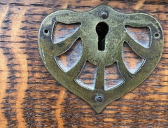 Reticulated escutcheon. 